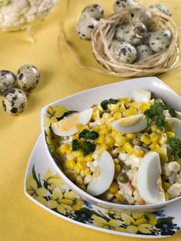 Easter-eggs salad with maize in plate