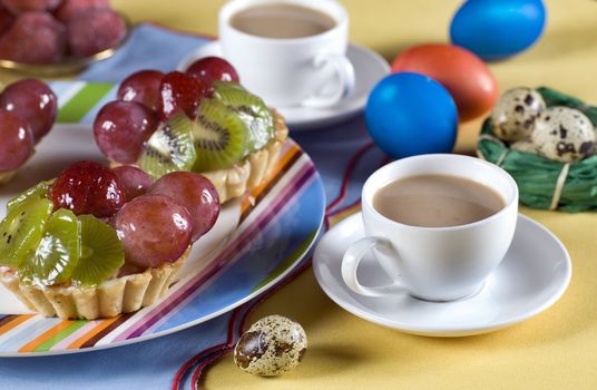 Easter fruit cake  in plate and eggs for background

