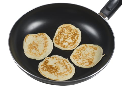 pancakes cooking in a pan

