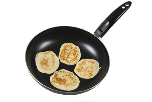 A luscious pancake cooking in a pan

