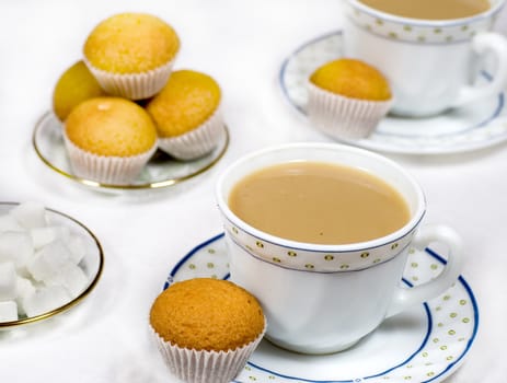 Cups of coffee and petit-four 


