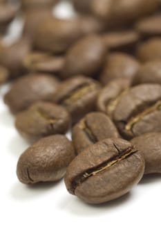 Raw coffee beans mackro shot on white background