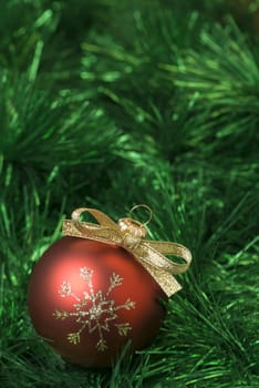 Red christmas balls on the green tinsel. aRGB.