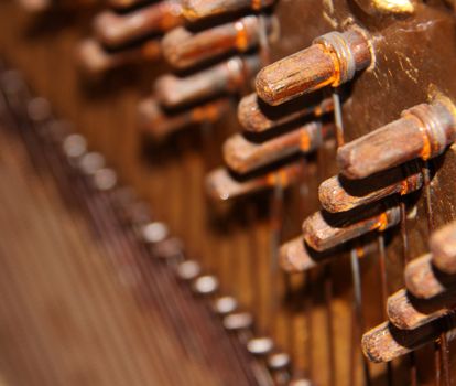 Inside of an Upright Piano - tuning knobs and strings