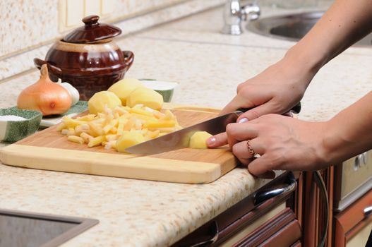 Meal preparation on kitchen from a potato