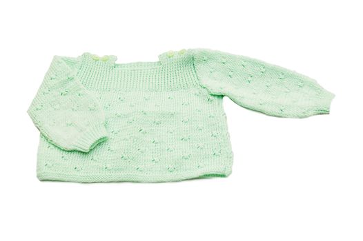 Wool hand-made green baby coat over white