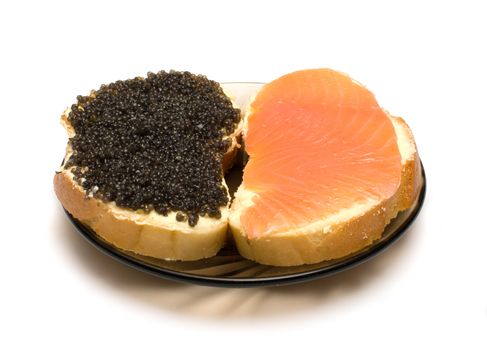 Sandwiches with a salmon and sturgeon caviar it is isolated on a white background.