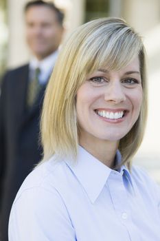 Portrait of a Pretty Blond Smiling Businesswoman Outdoors