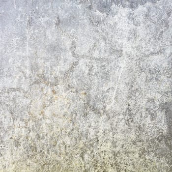 Texture of a grunge gray concrete wall covered a dirt