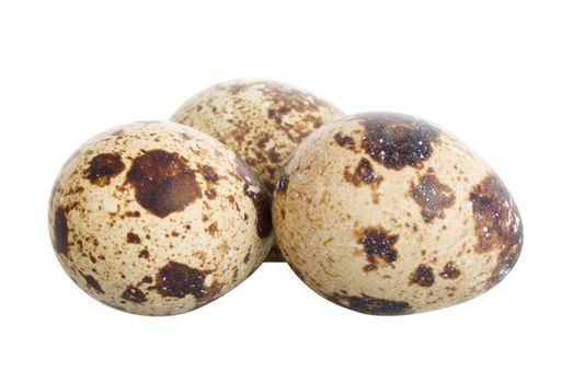 three quail eggs, isolated on white
