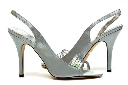 Elegant female shoes with a high heel on a white background