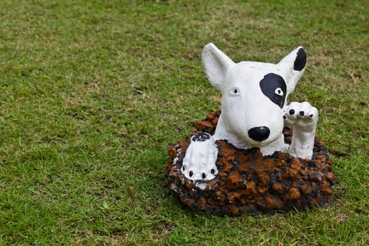 statue of a dog decorated on the lawn