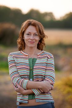 Adult women in striped dress in nature