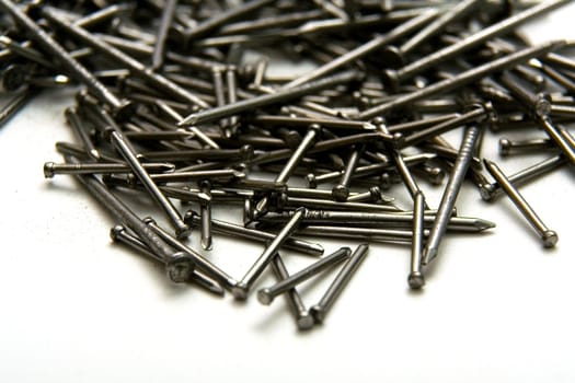 Stack of iron nails on white background