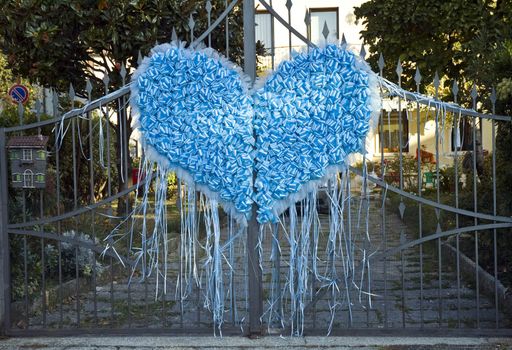 heart made of blue ribbons to celebrate a birth 