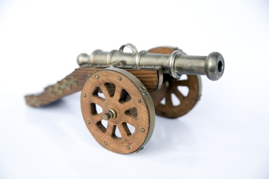 model of an old cannon isolated on white background