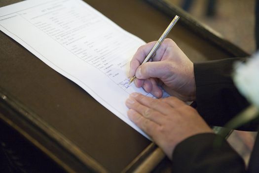 signing the wedding document after the wedding ceremony