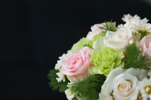 bunch of beautiful roses over black background