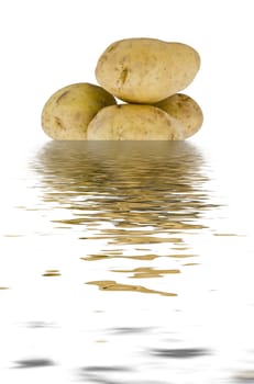 four young potatoes dipped in wavy water
