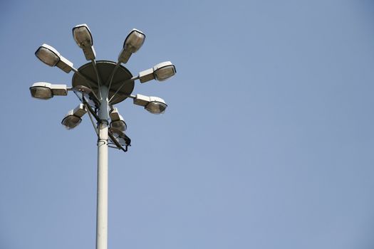 a street lamp on the blue sky