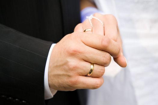 marriage ceremony - two lover's hands just after marriage ceremony