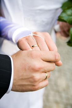 marriage ceremony - two lover's hands just after marriage ceremony