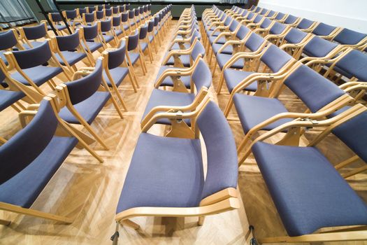 empty rows of chairs in conference room