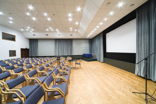 empty rows of chairs in conference room