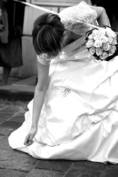 collecting money by young bride after church wedding