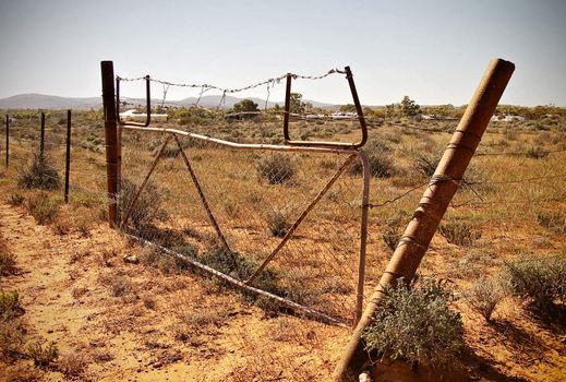 an old fence in the desert