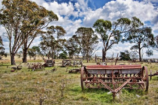 old farm machinery and equipment in the field