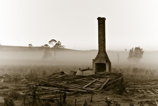 an old farm house lays ruined in a pile of rubble