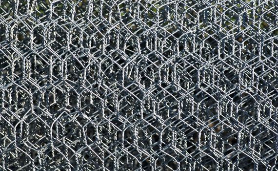 background image of rolls of metal wire mesh