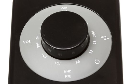 circle am fm tuner of a dark radio