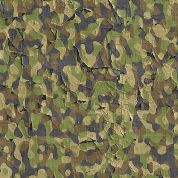 image of old flaking and peeling camouflage material