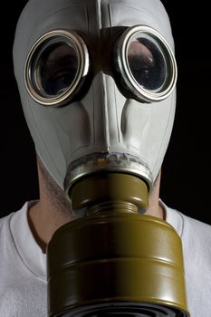 a man wearing a gas mask environment danger concept image