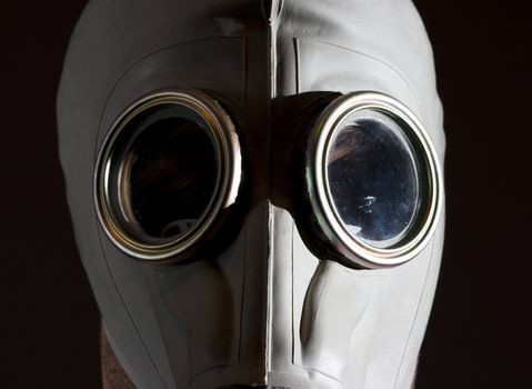 a man wearing a gas mask environment danger concept image