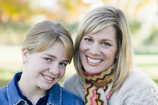 Portrait of a Mother and Daughter Sitting Together in a Park