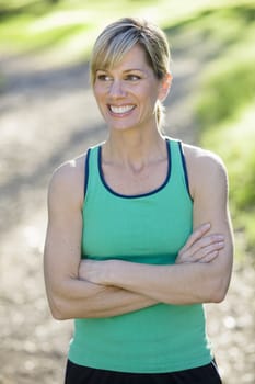 Pretty Athletic Woman Standing Outdoors Looking Away From Camera