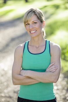 Pretty Athletic Woman Standing Outdoors Smiling To Camera