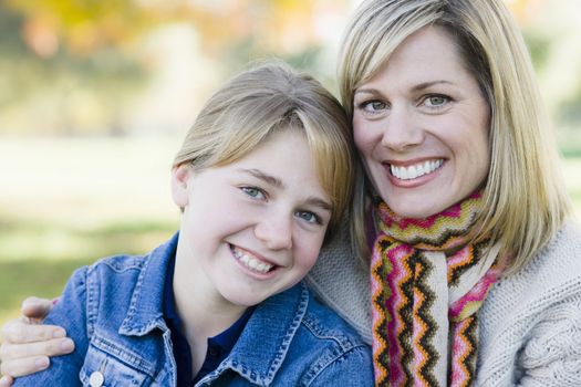 Portrait of a Mother and Daughter Sitting Together in a Park