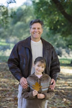 Portrait of a Father and Daughter Together in a Park