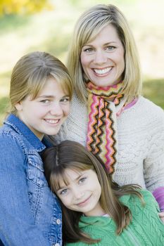 Portrait of a Mother and Daughters Together in a Park