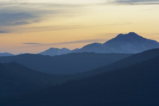 sunset scenic of a mountain range in the nature
