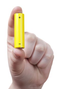 hand with an aa size battery over a white background