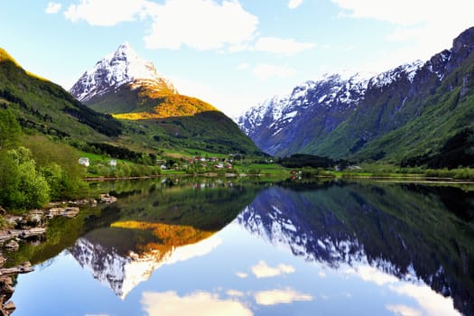 Norway village between lake and  mountains