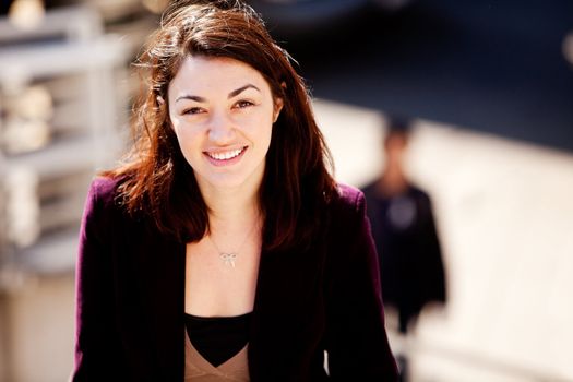 A candid portrait of a young woman in the city