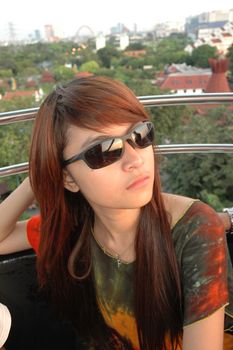 young asian lady wearing black sunglass