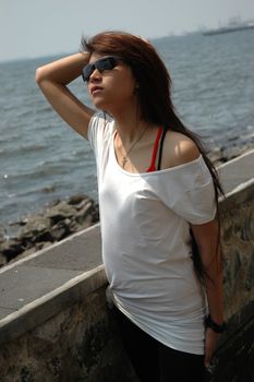 young asian lady wearing black sunglass