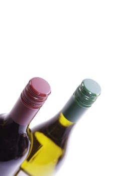 Two bottles of wine. one red, one white. Image from above with forshortened perspective and soft focus. Set on an isolated white background in a portrait format, set at an angle.
